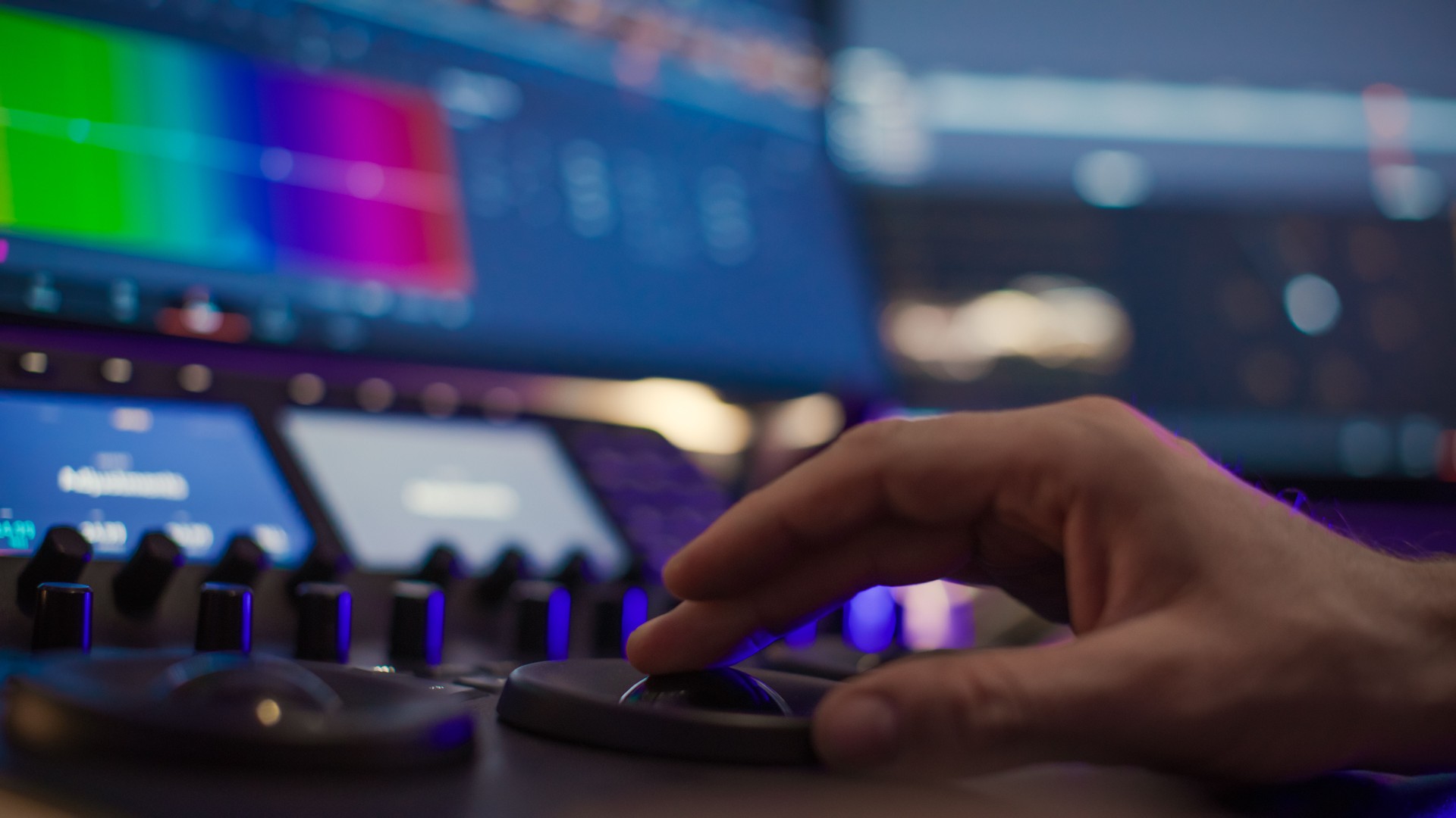Male editor hand working with footage on computer at desk