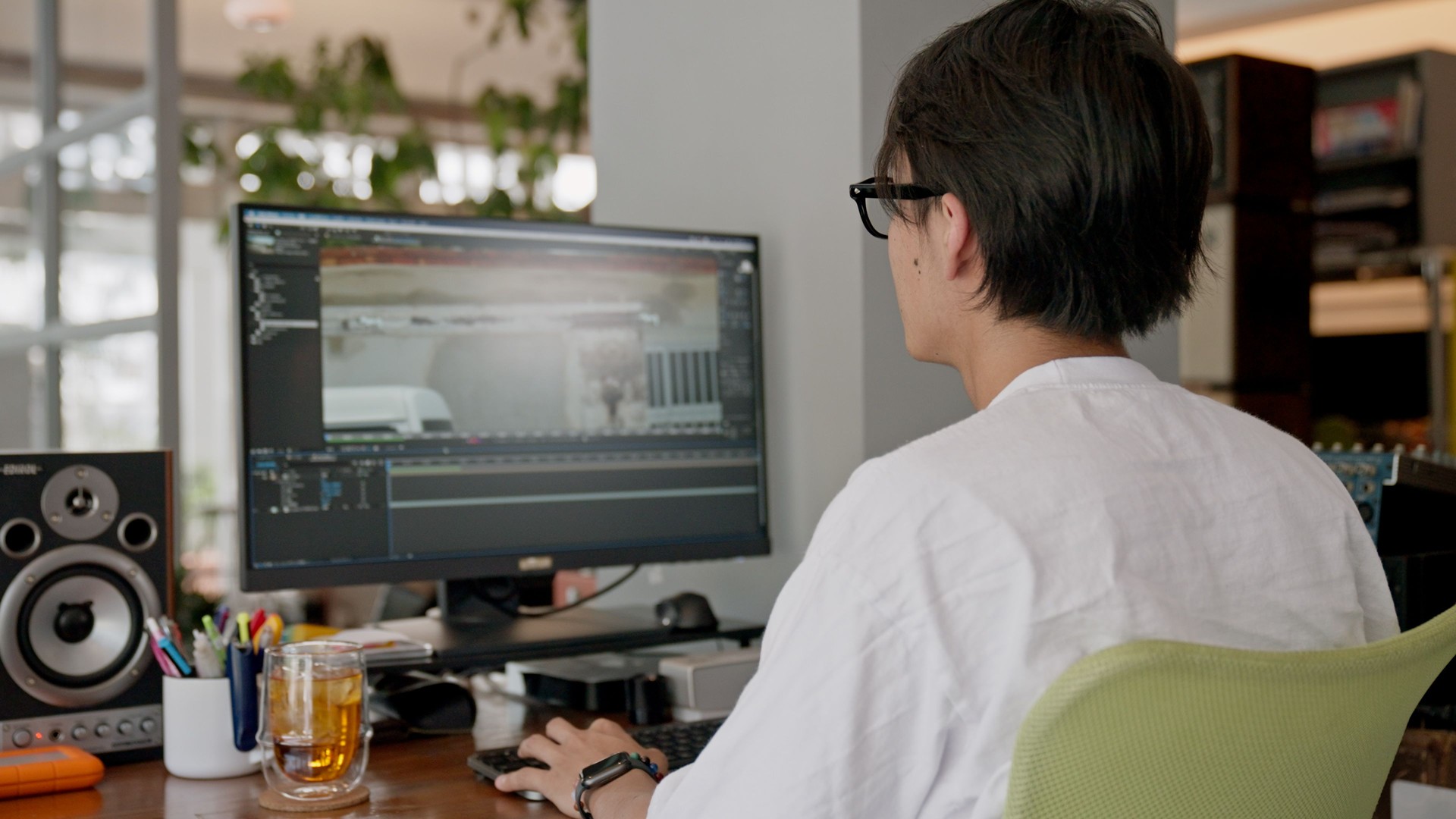 Young man editing video at the office.